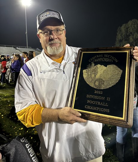 Head Coach Rich Tuman with the championship trophy.